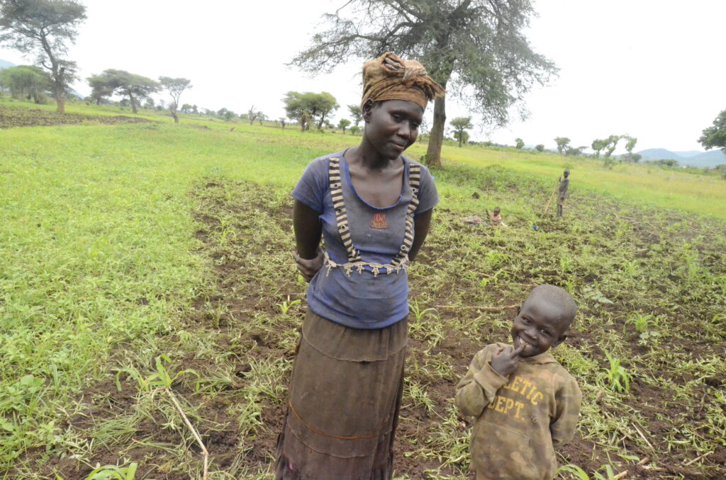 Apoko Evelyn a mother of four is hopeless affected by the delays in completing the irrigation scheme . She now relies on rain which is also un reliable 3 2