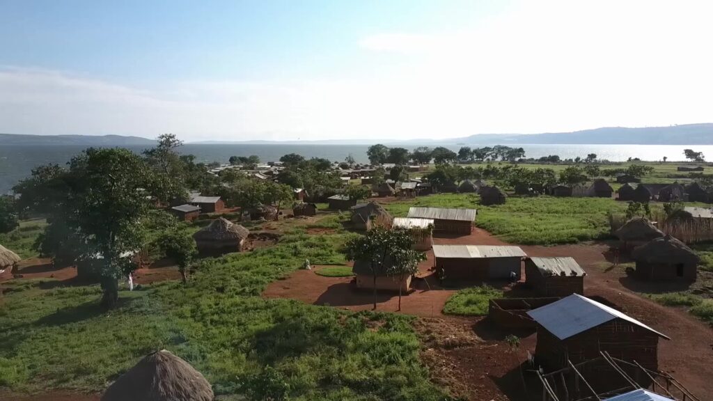 uganda photo overview of village with lake behind trim 004
